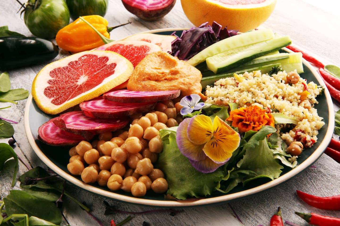 Bowl of Buddha, The concept of a healthy diet: chickpeas, salad, beetroot, pumpkin, cucumber, grapefruit, cabbage and tabouleh. Balanced food.