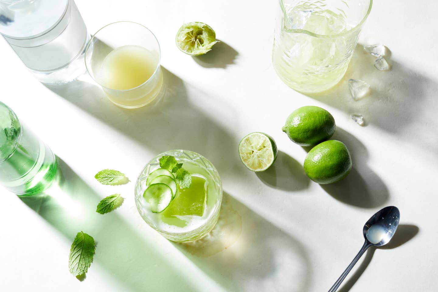 Lime and soda cocktail preparation, overhead view