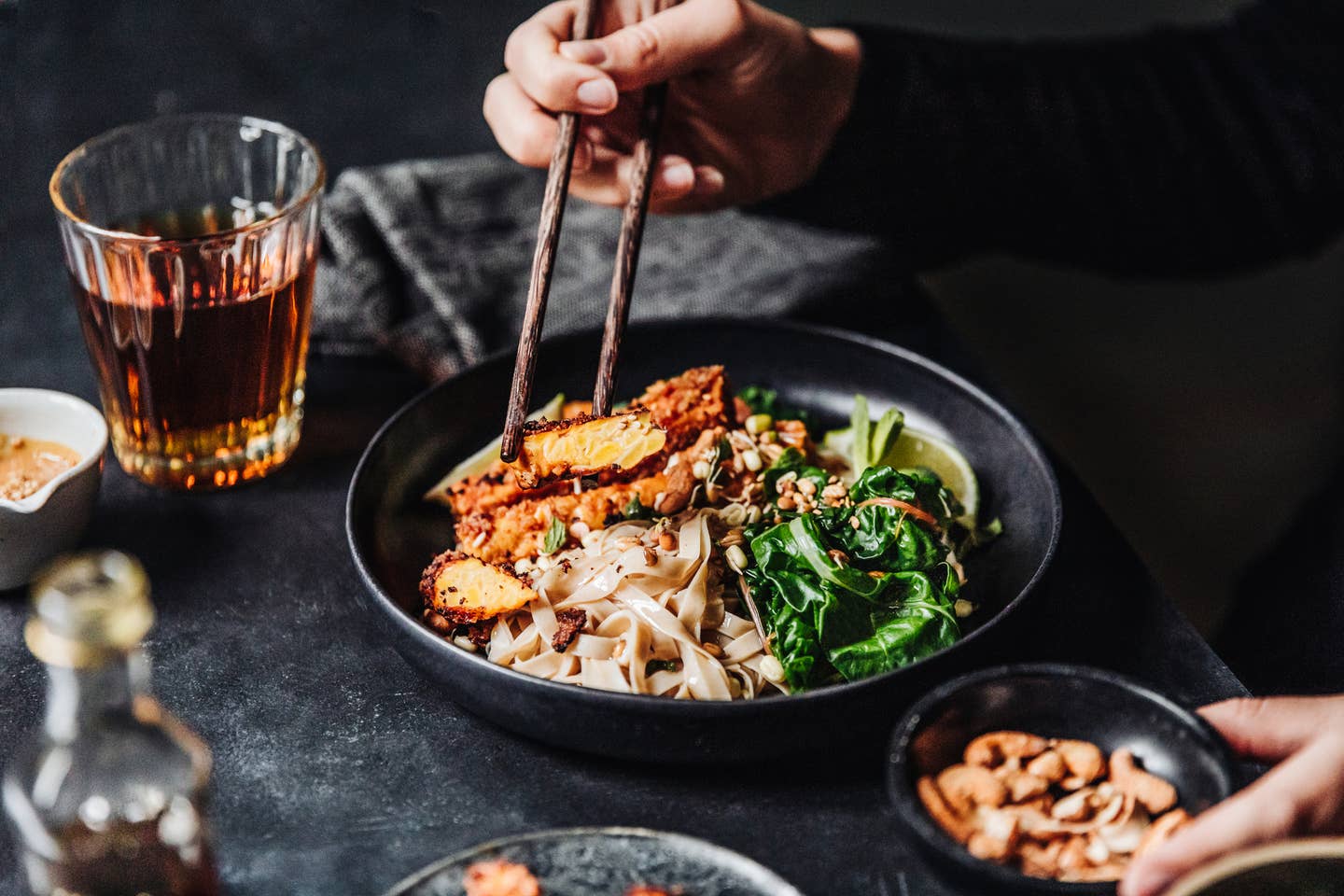 Woman eating freshly made Asian vegan meal