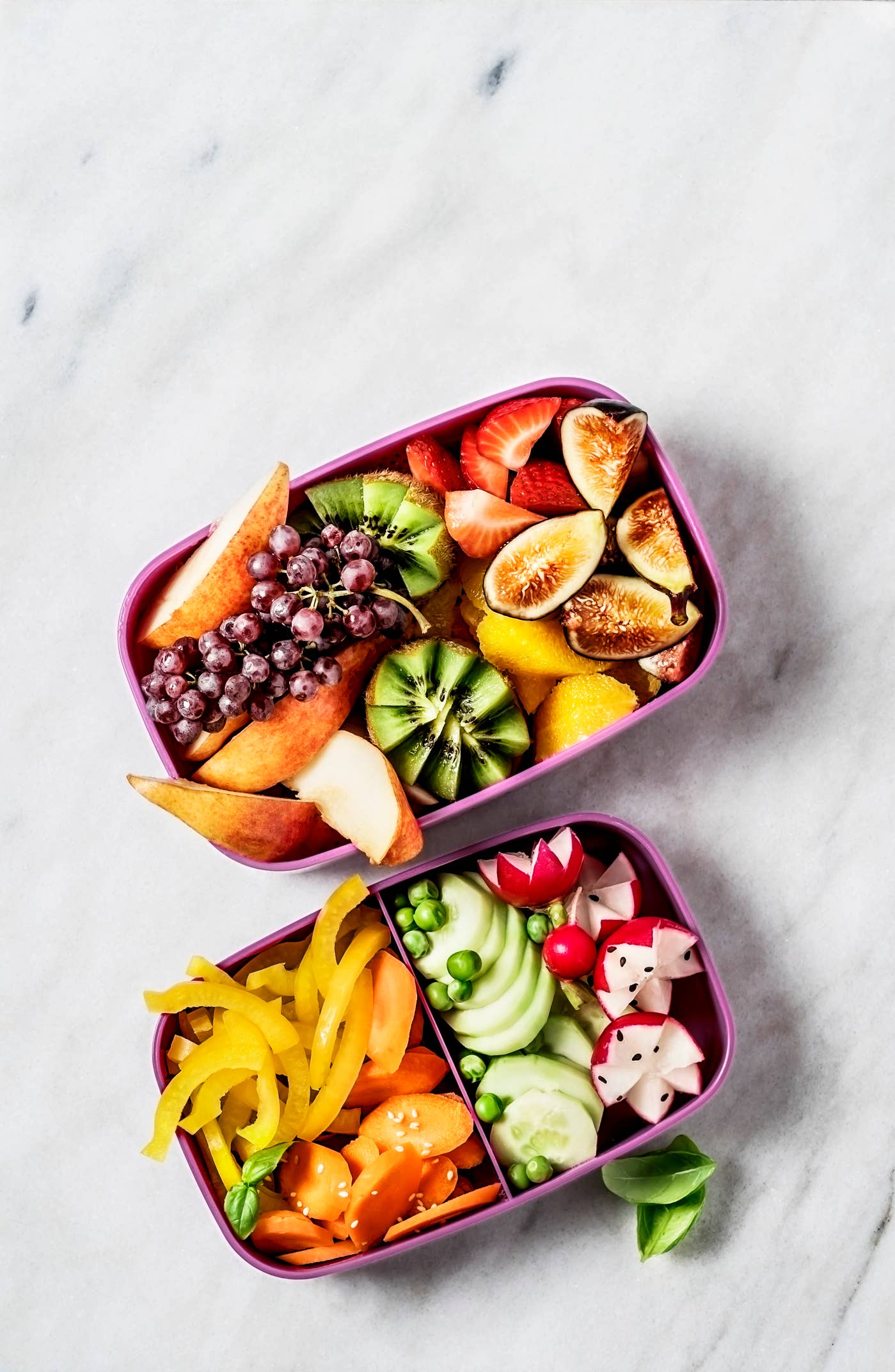 Lunch boxes with vegetables and fruits