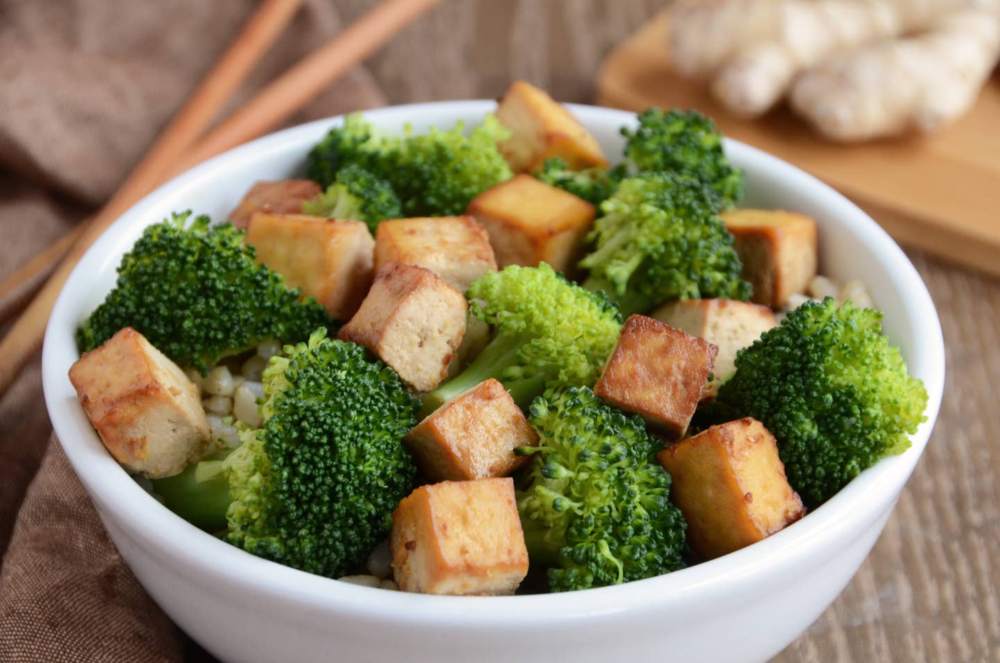 Bowl of ginger baked tofu with broccoli and brown rice