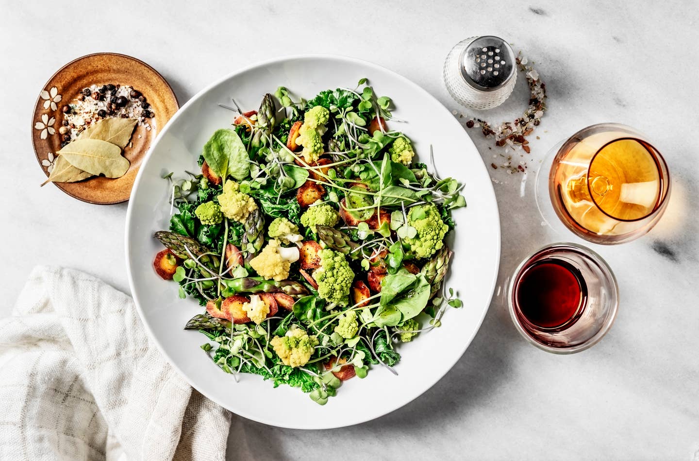 A bowl of fresh salad on white background