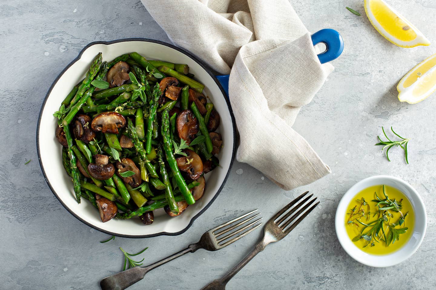 Asparagus and mushrooms in a cast iron pan