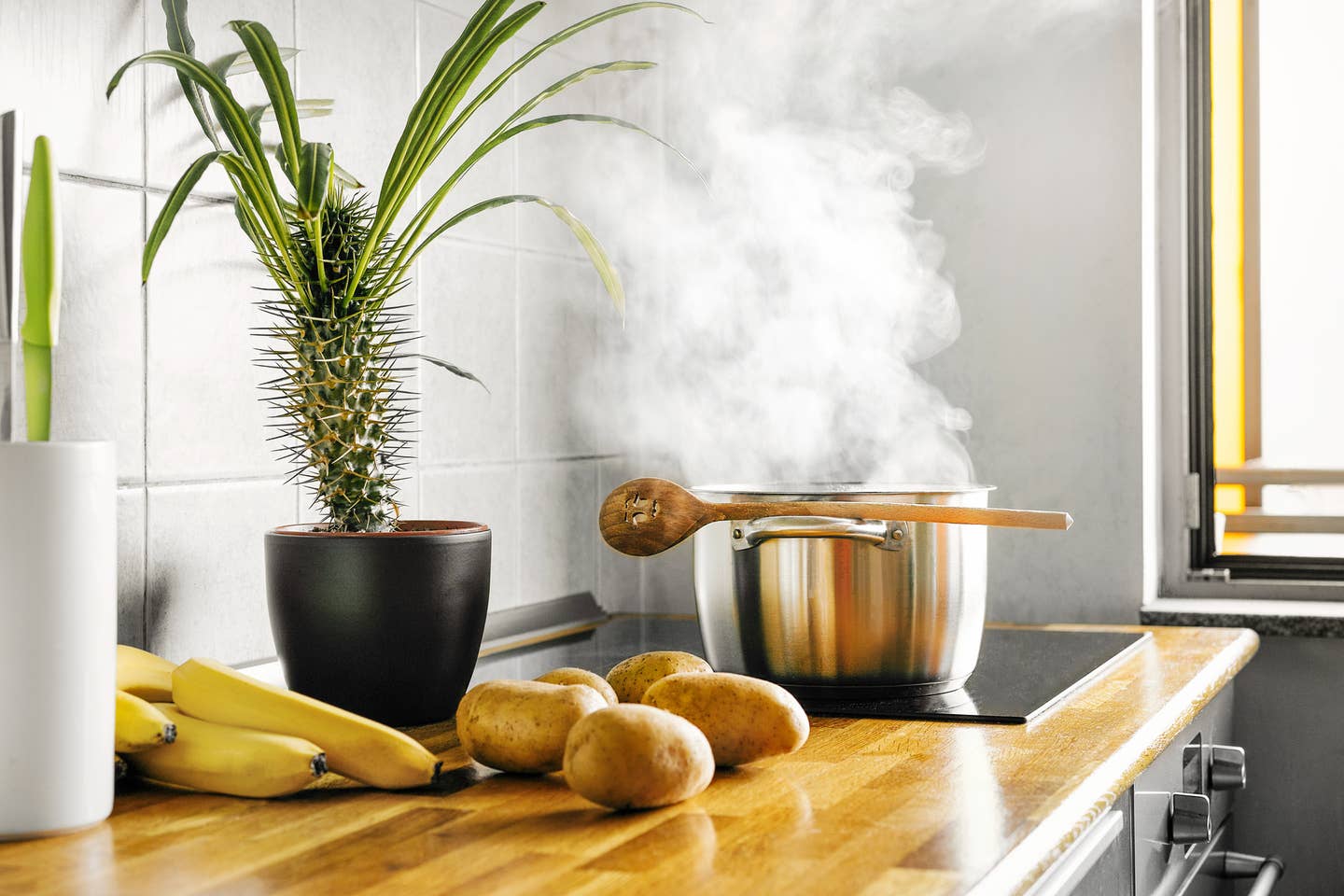 Boiling Pot On Oven In Kitchen At Home