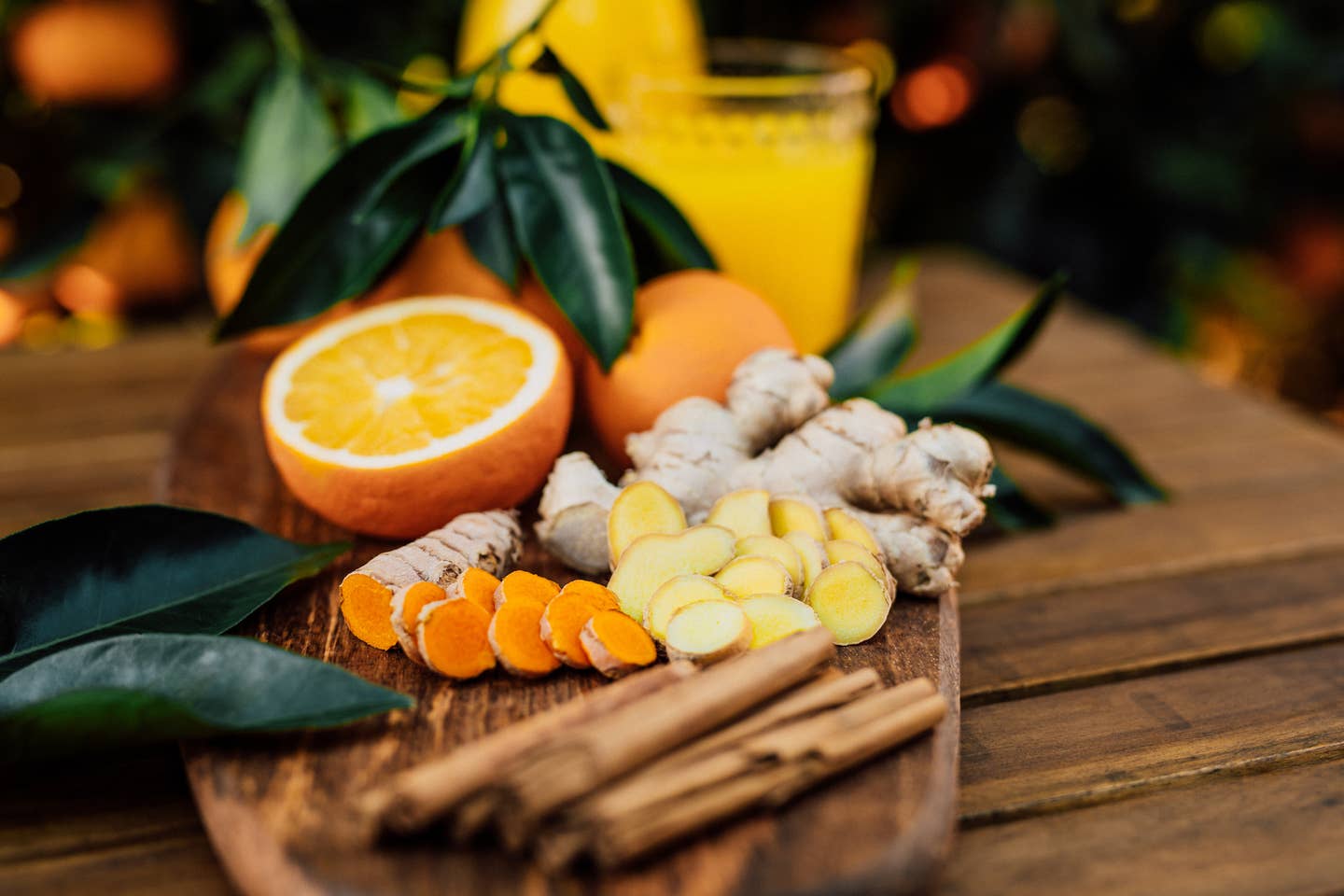 Turmeric and ginger root with cinnamon sticks and freshly squeezed orange juice of untreated Bio oranges from the own garden