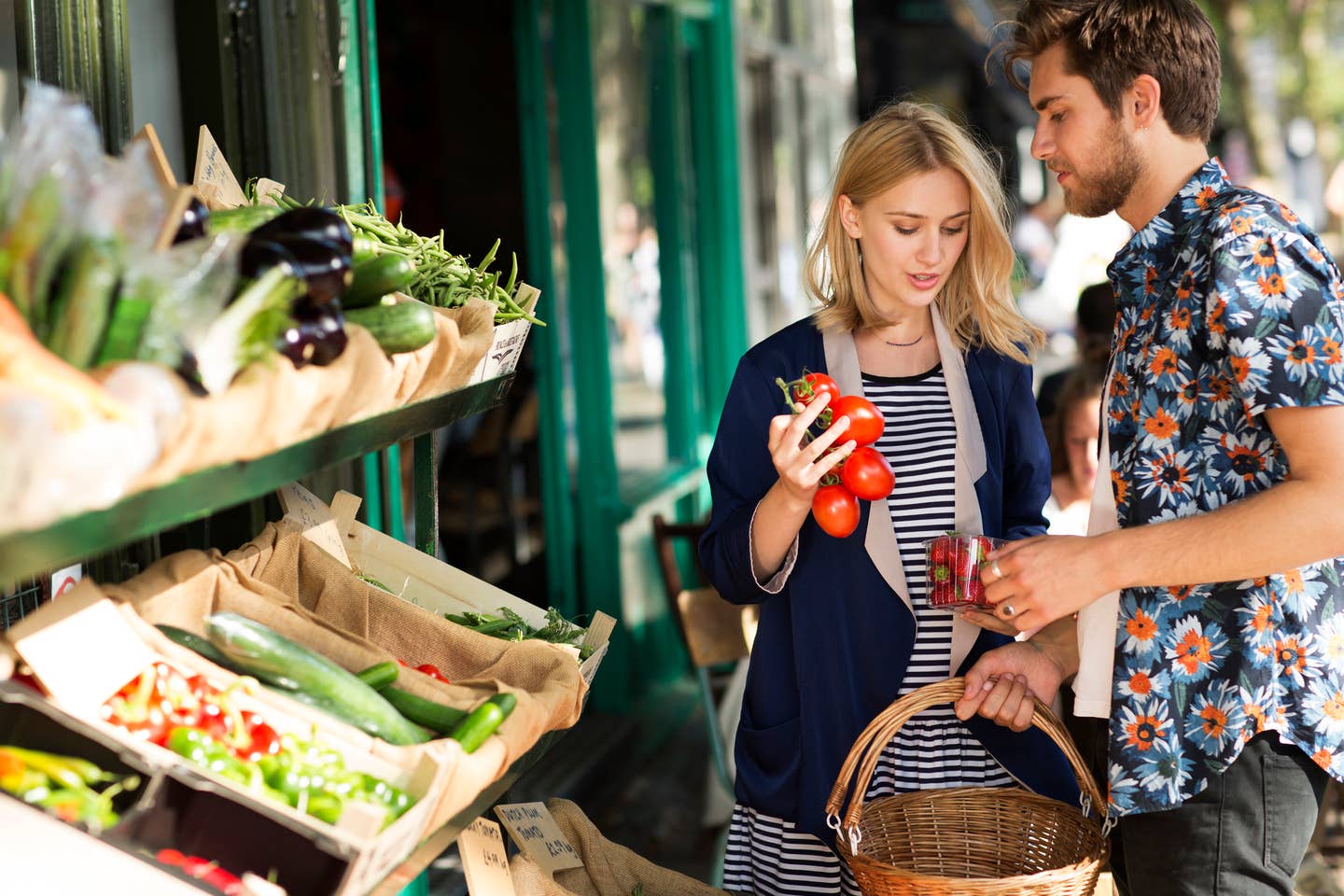 Couple buying organic produce at store