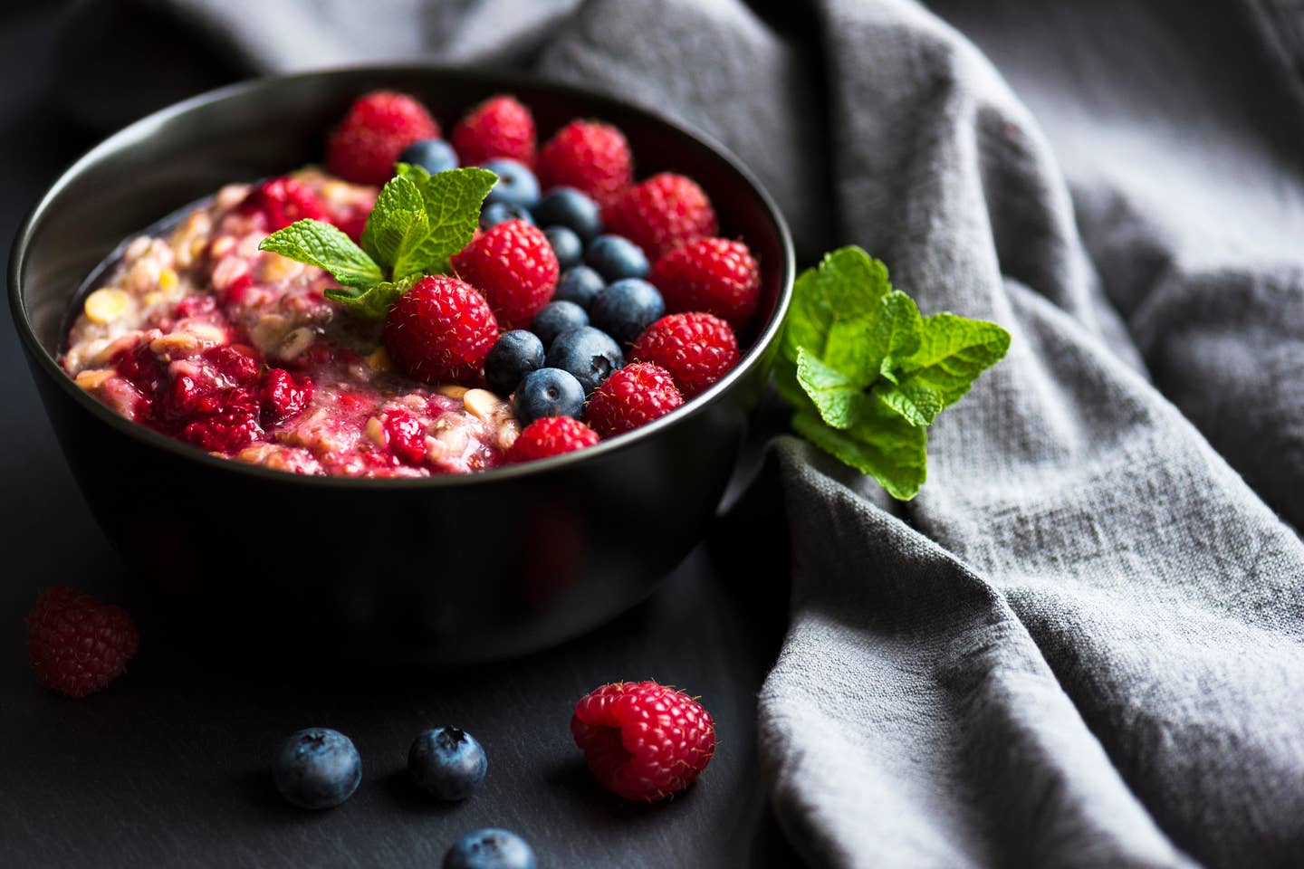 Healthy organic porridge topped with berries