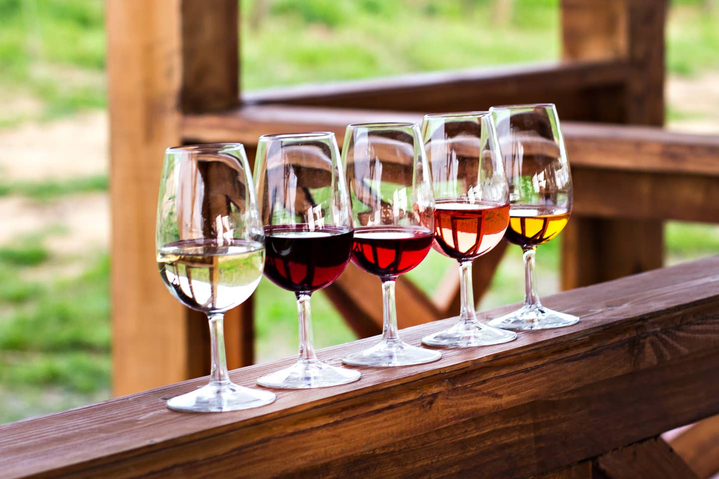 Glasses with wine. Red, pink, white wine in glasses. set of glasses with red, white and rose wine Tasting wine in the vineyard.